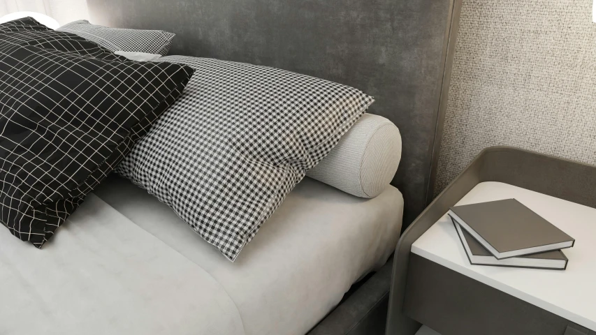 a sofa with a white bedding and several black cushions