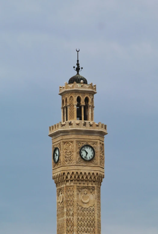 a large clock tower with some sky in the background