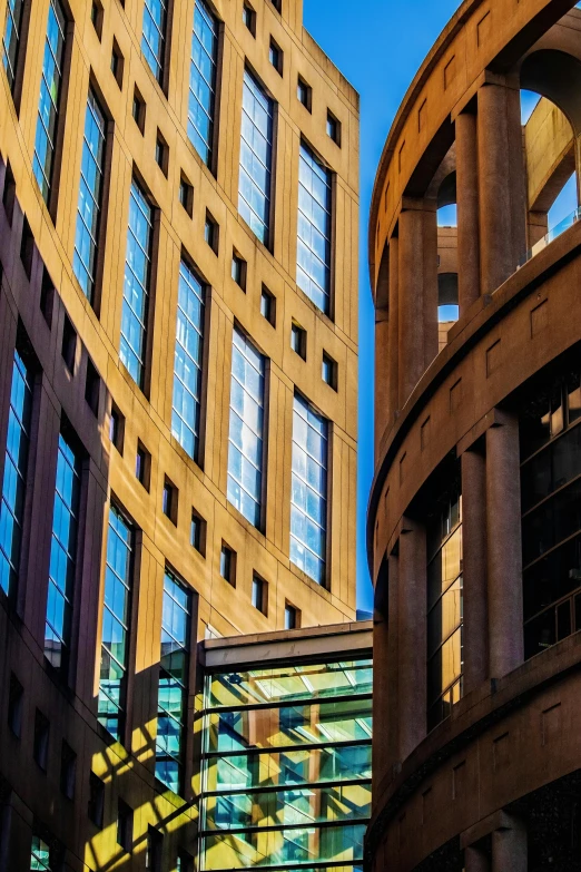 two buildings with circular windows next to each other