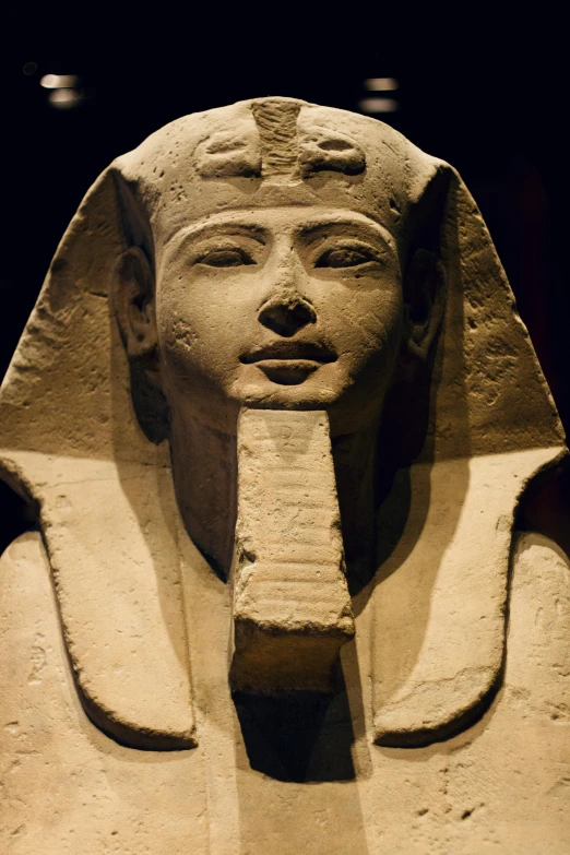 an egyptian statue of an egyptian pharaoh wearing a long necktie