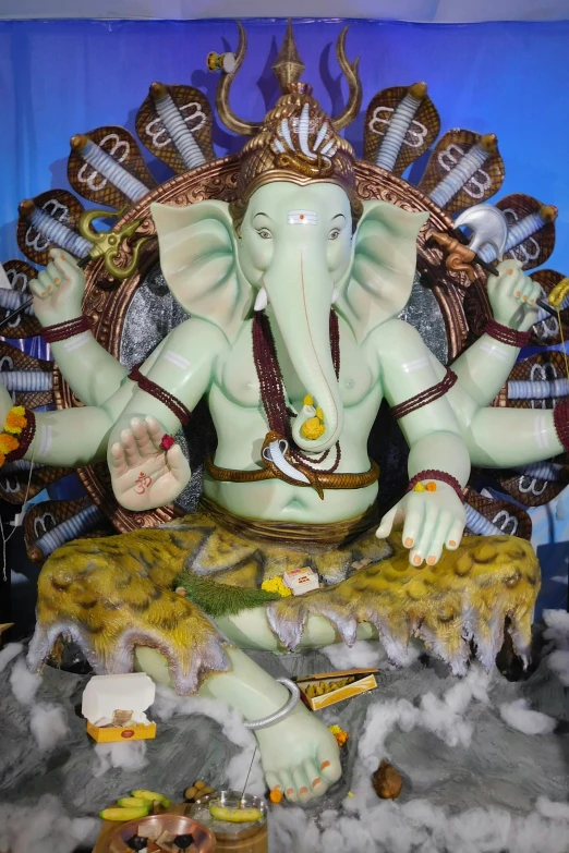 the statue of a statue of an elephant is in front of a banner