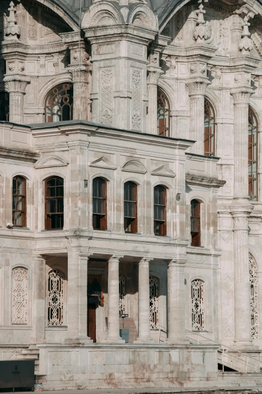 an old white building with very ornate windows