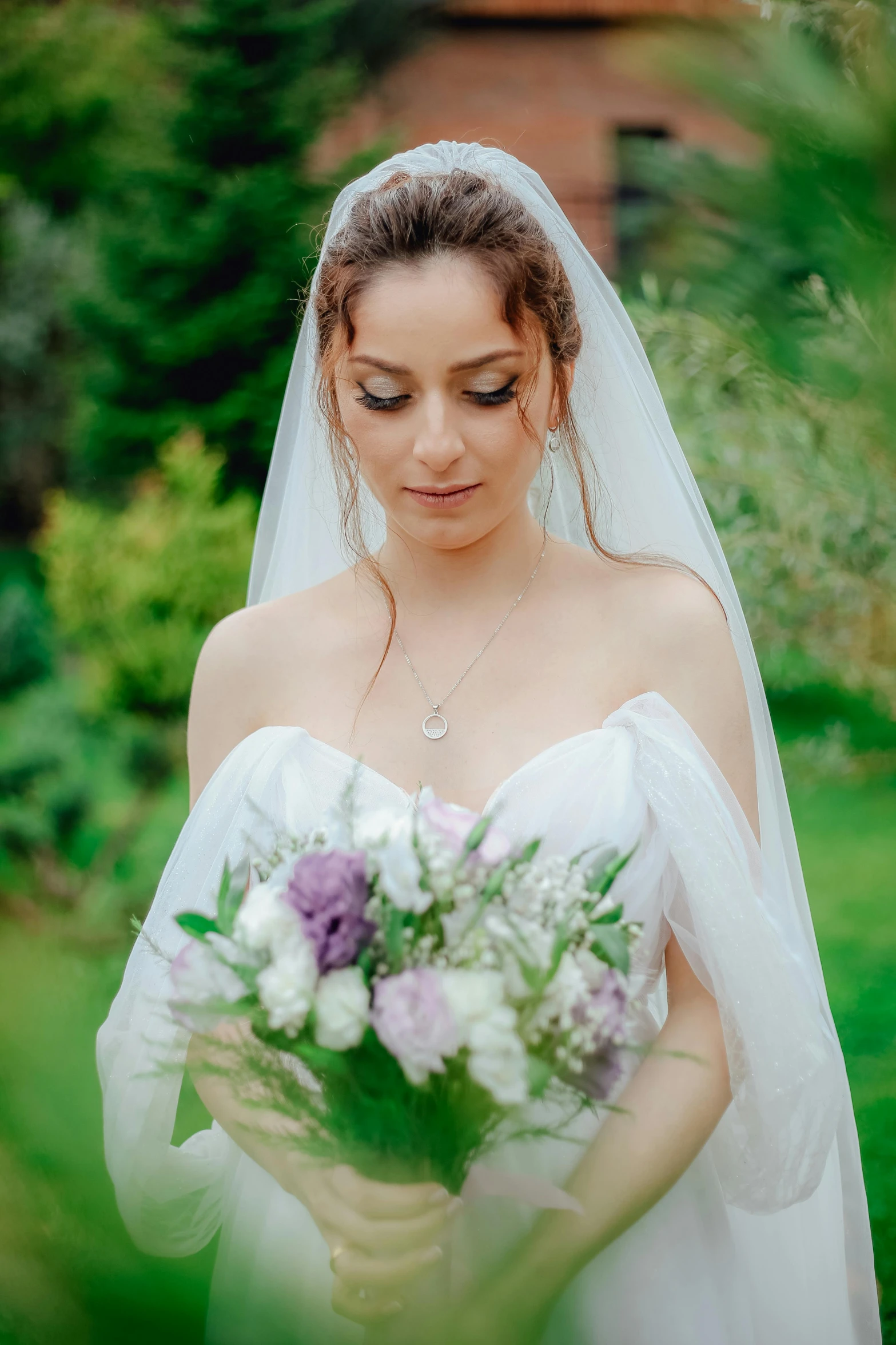 a bride posing with her wedding bouquet