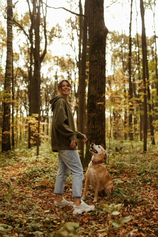 a person is posing for a po with a dog