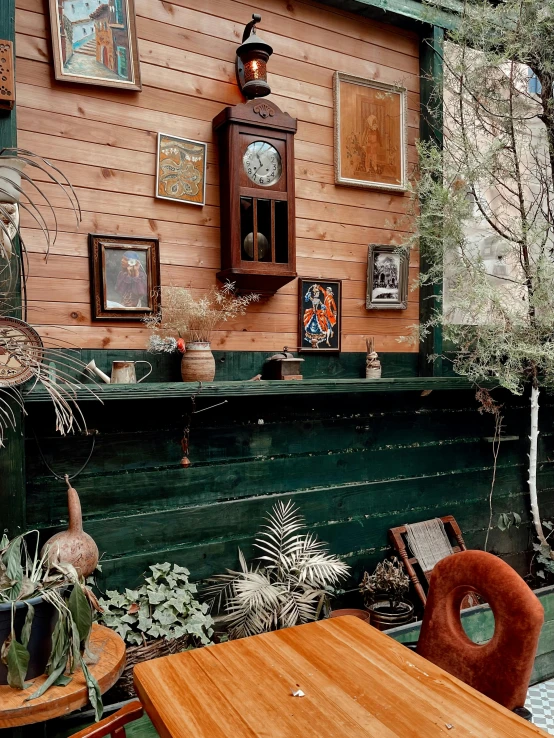 a porch with a wooden table and two chairs