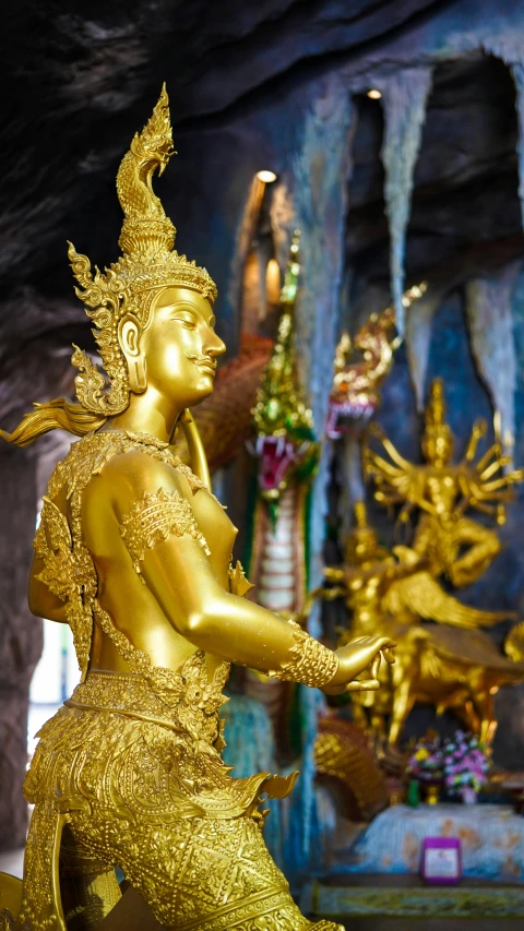 an image of a gold statue of a man