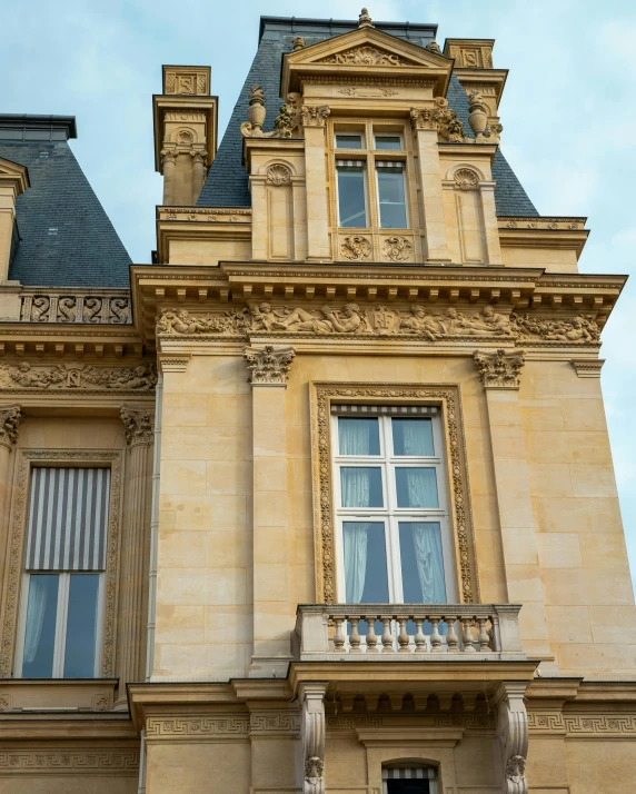 an old palace style building with an iron guard rail