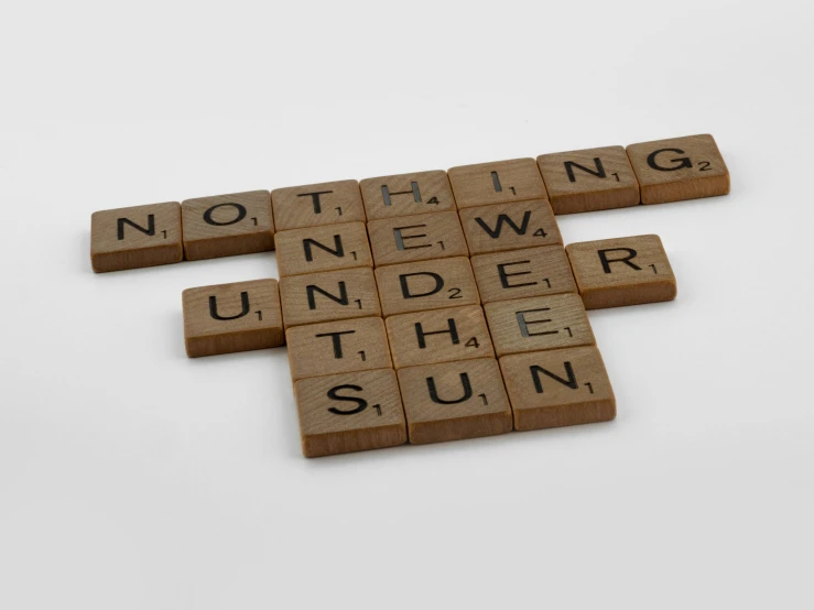 a scrabble word tile on the side of a table