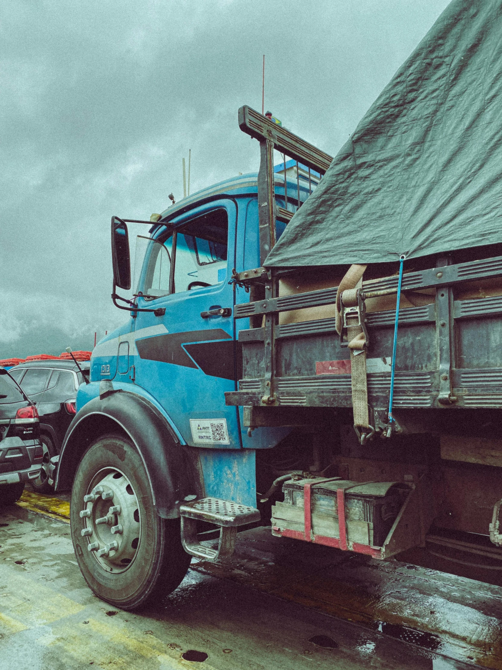 a large truck has the trailer loaded with items