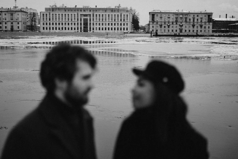 black and white image of two people looking at each other