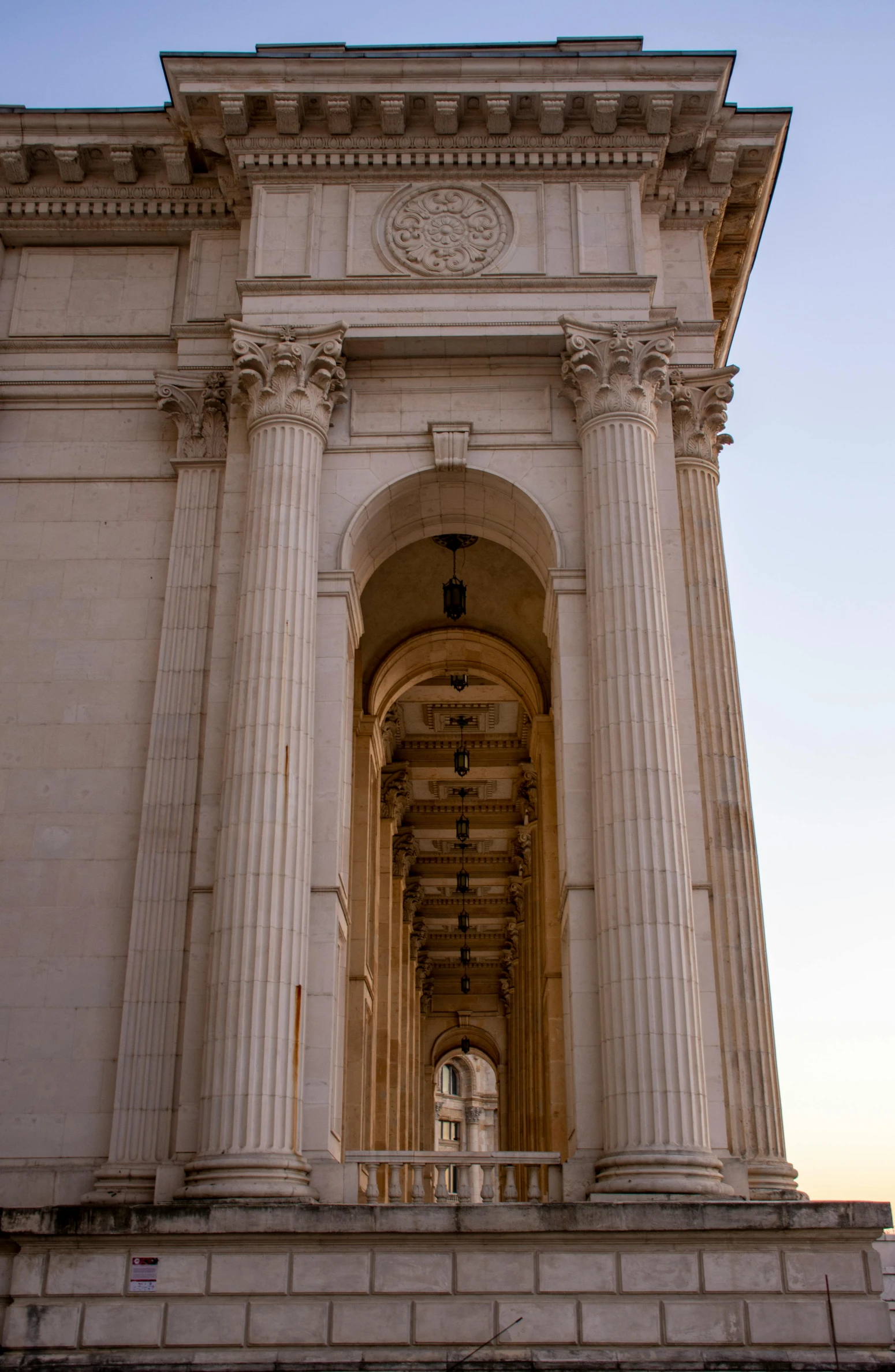 a tall building with columns and pillars on top