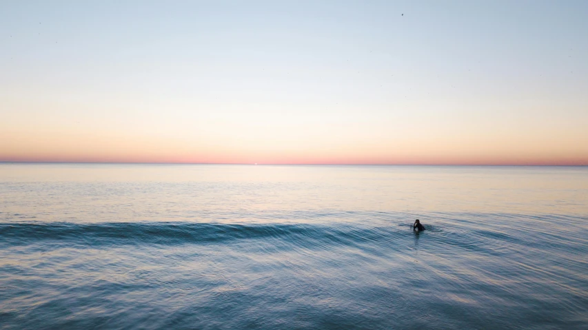 an ocean that is very clear and calm