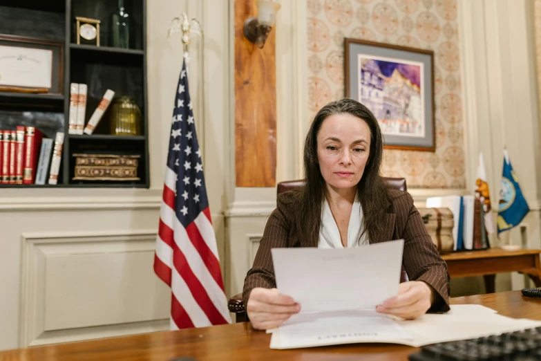 a woman looking through a piece of paper