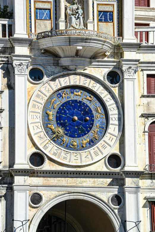 the clock has gold and blue details at its base