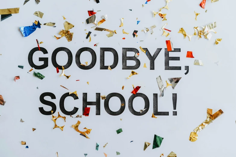a picture of the words goodbye on top of school confetti