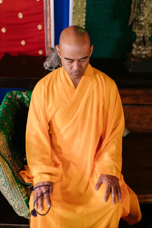 a man in a large yellow outfit looking at soing