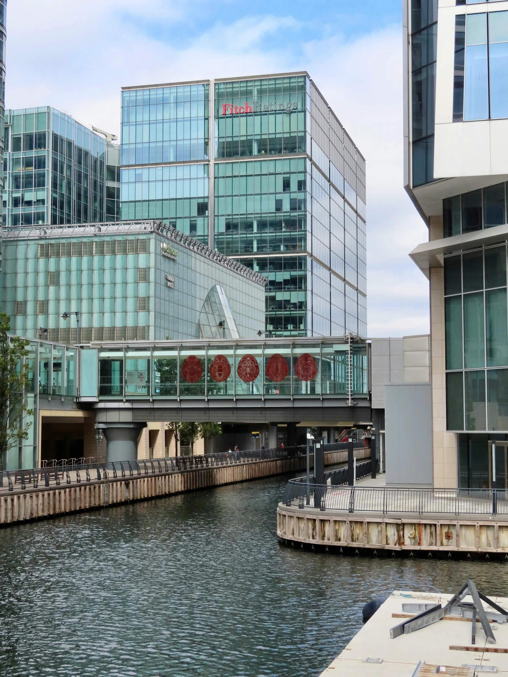 a river running between some tall buildings on either side