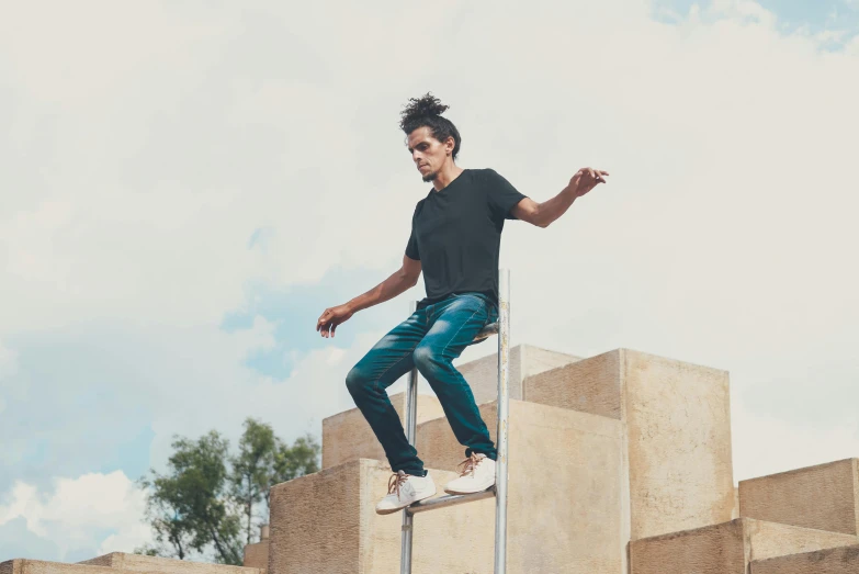 a man is riding a skateboard on a metal pole