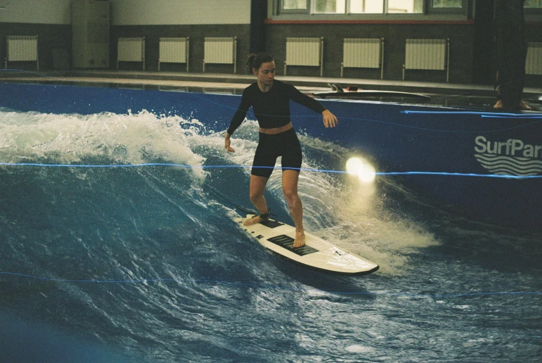 a man on a surfboard rides an ocean wave