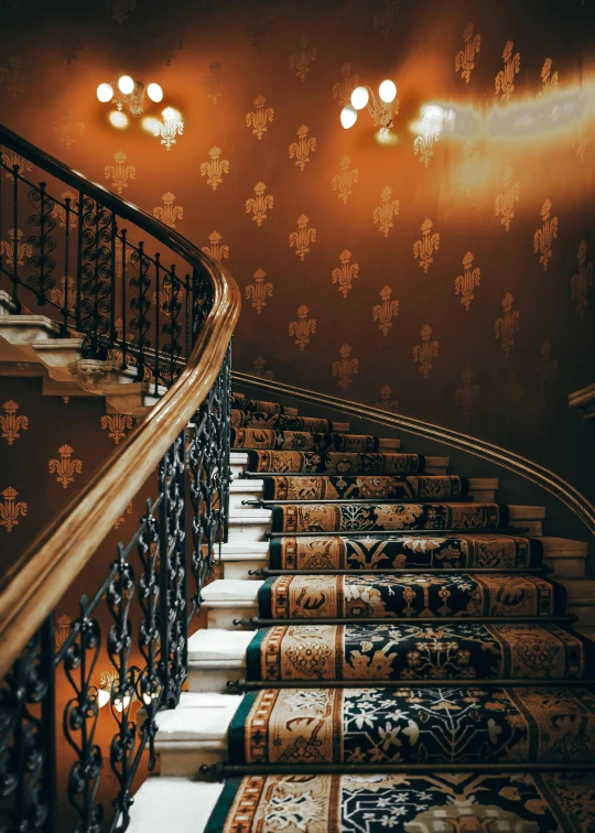 a staircase with lights on above the steps