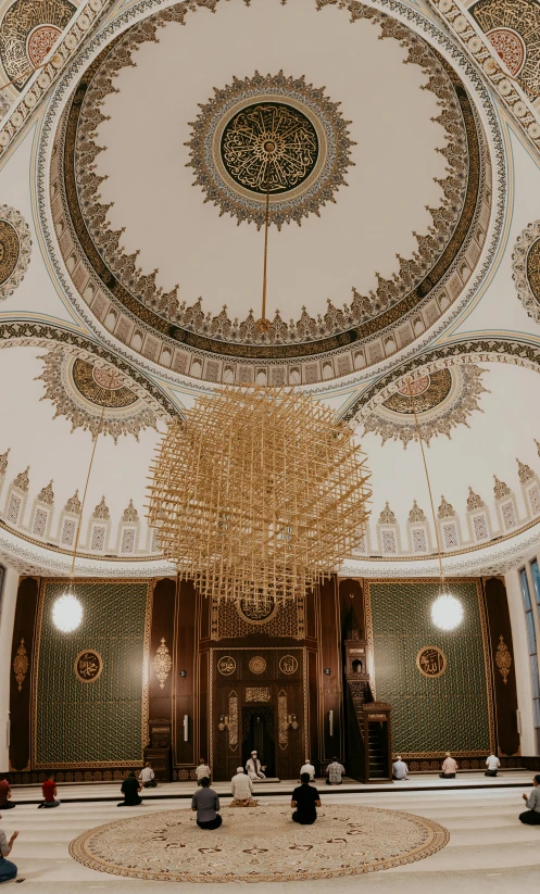 inside an ornately decorated ballroom with a chandelier and carpet