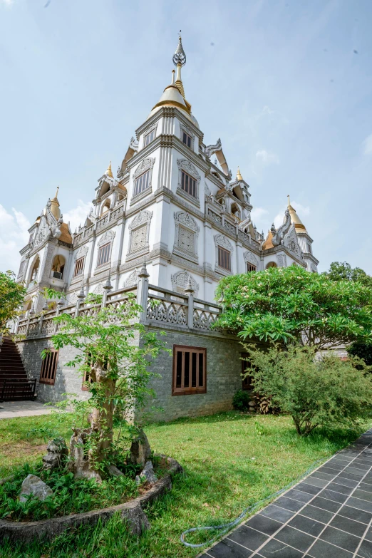 the architecture of the building is in white and gold