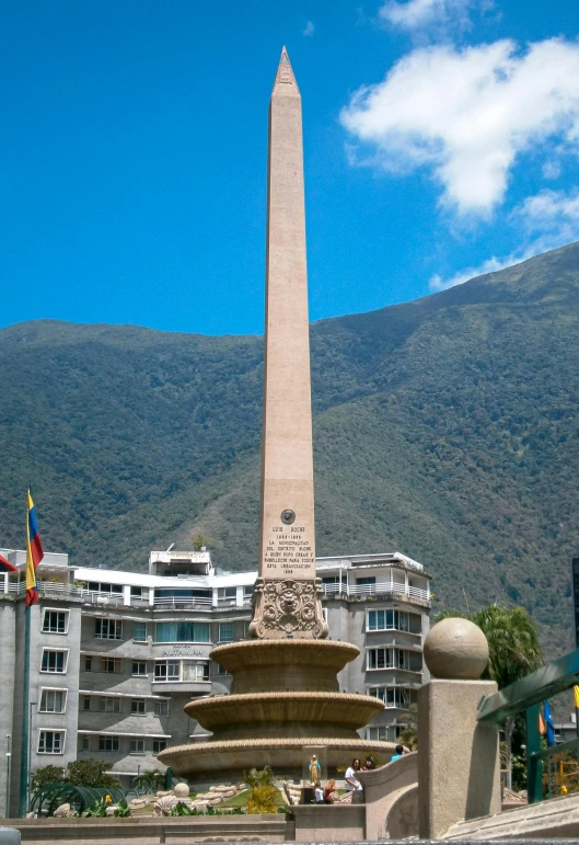 a very tall monument sitting on top of a cement planter