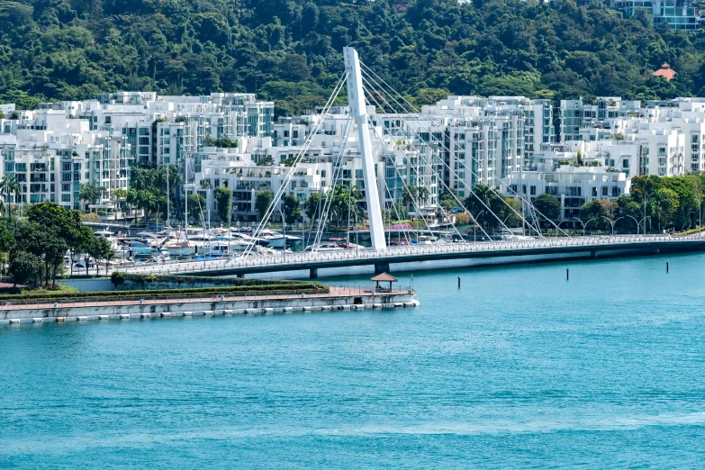 sailboats are in the water near boats and buildings