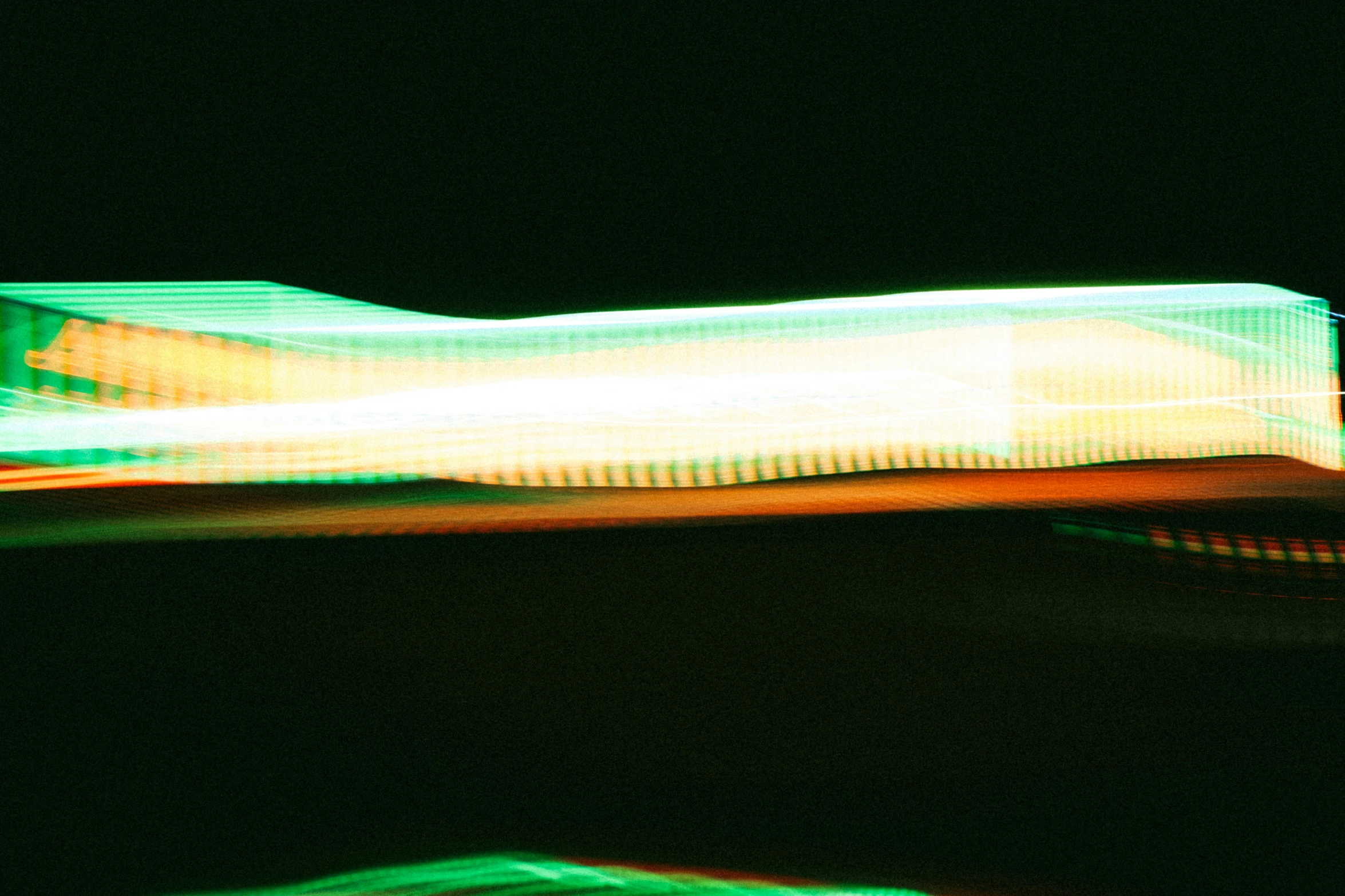 blurred image of a truck traveling on a road