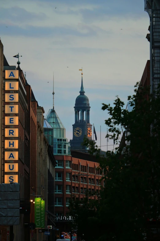 a city with tall buildings and a clock tower