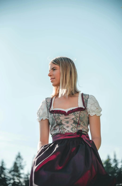 young beautiful woman in fancy dress looking up