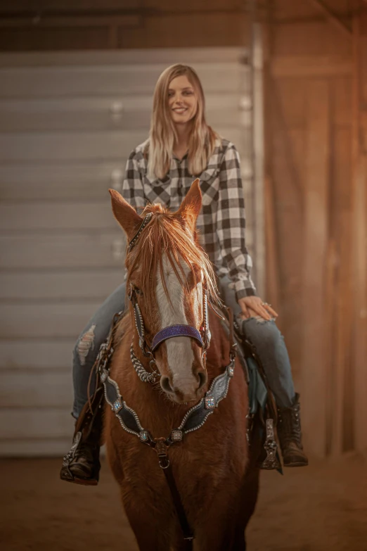 woman on a horse smiling for the camera