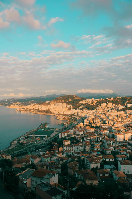 the view from above the city with a lake and mountains in the background