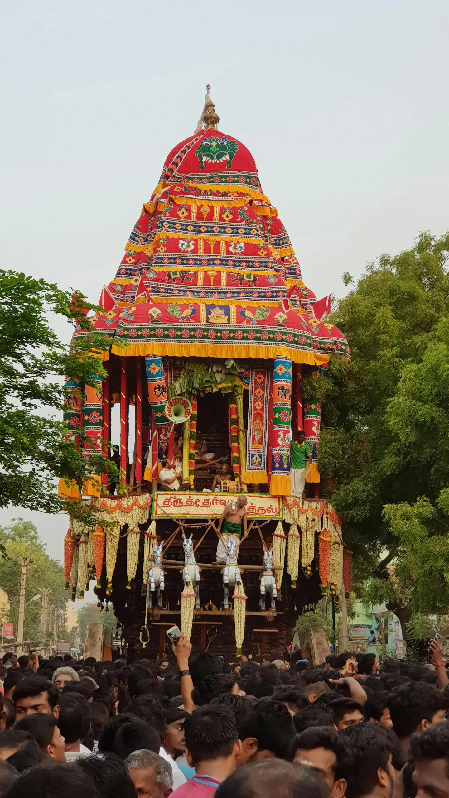 a colorfully decorated indian structure with people
