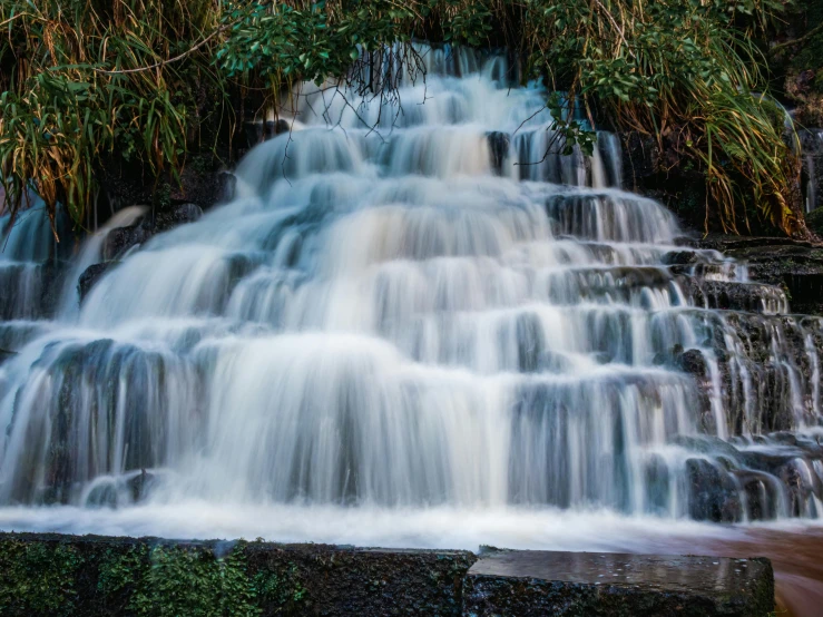 waterfall with water cascading over it