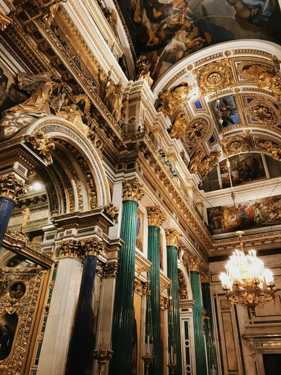 the ceiling of the ornately decorated church is very ornate