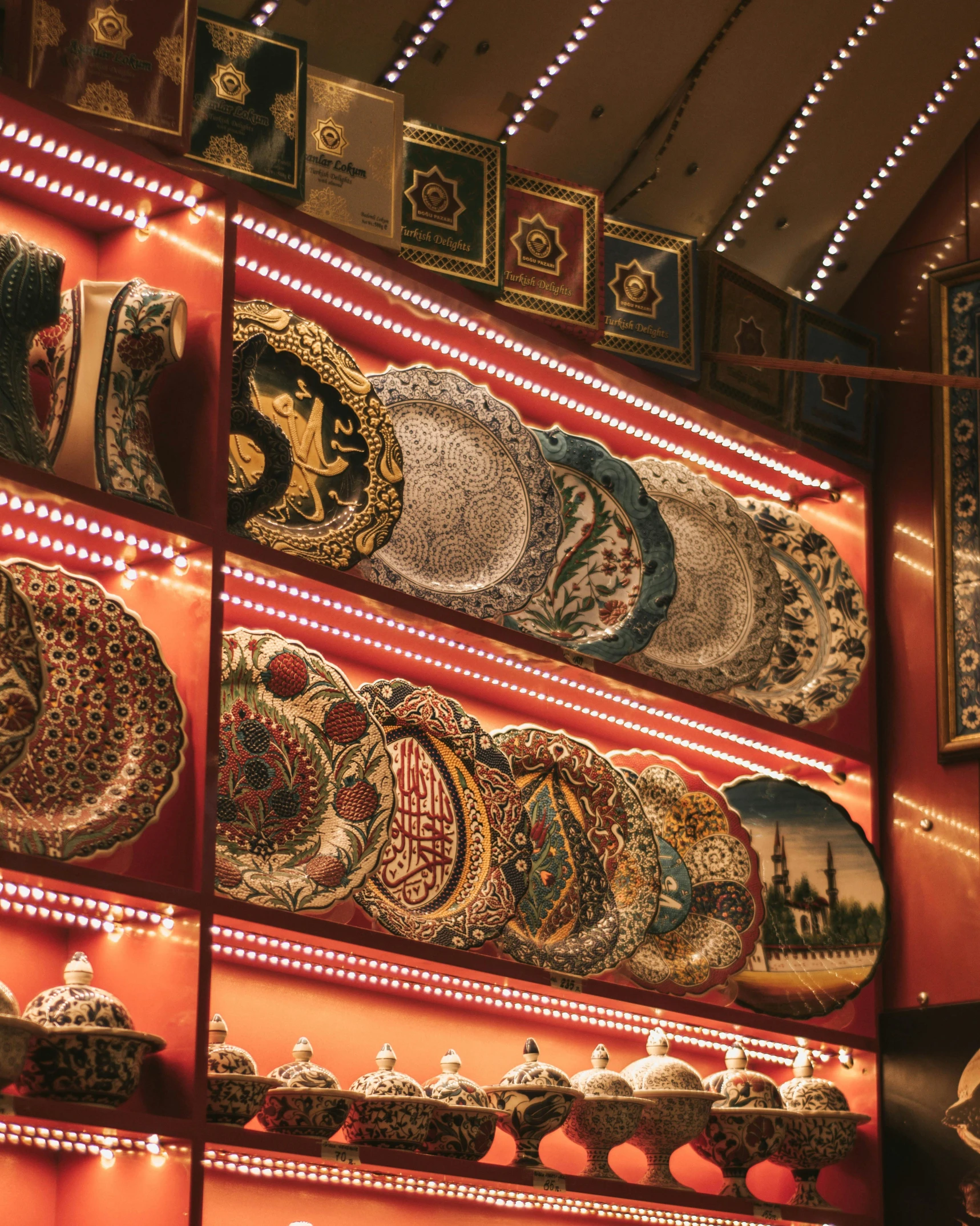 a display case full of oriental items on a wall