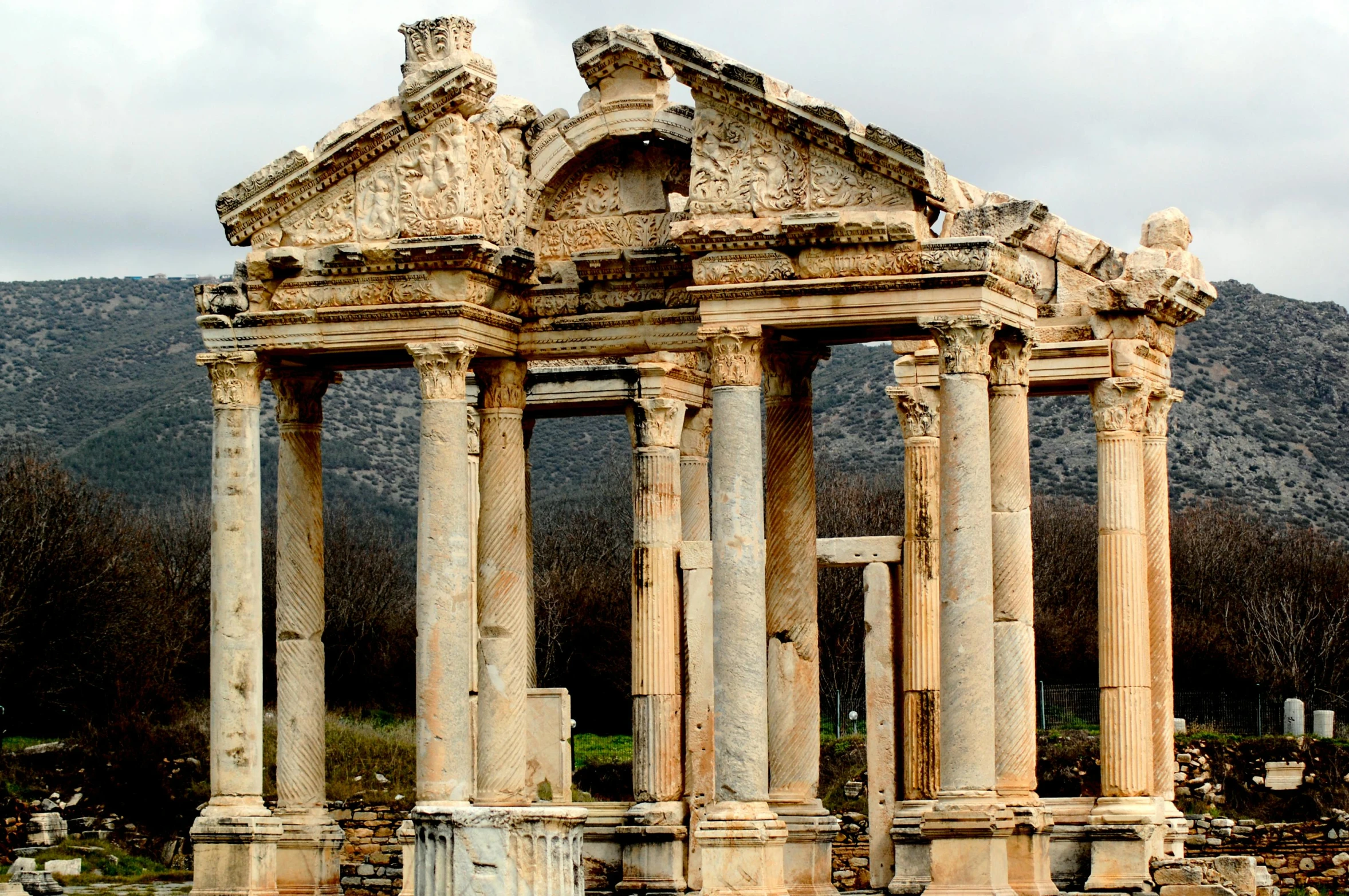 an old church with pillars and statues