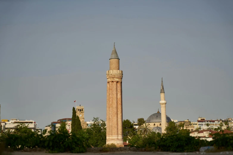 an ornate building tower with two minalis is seen