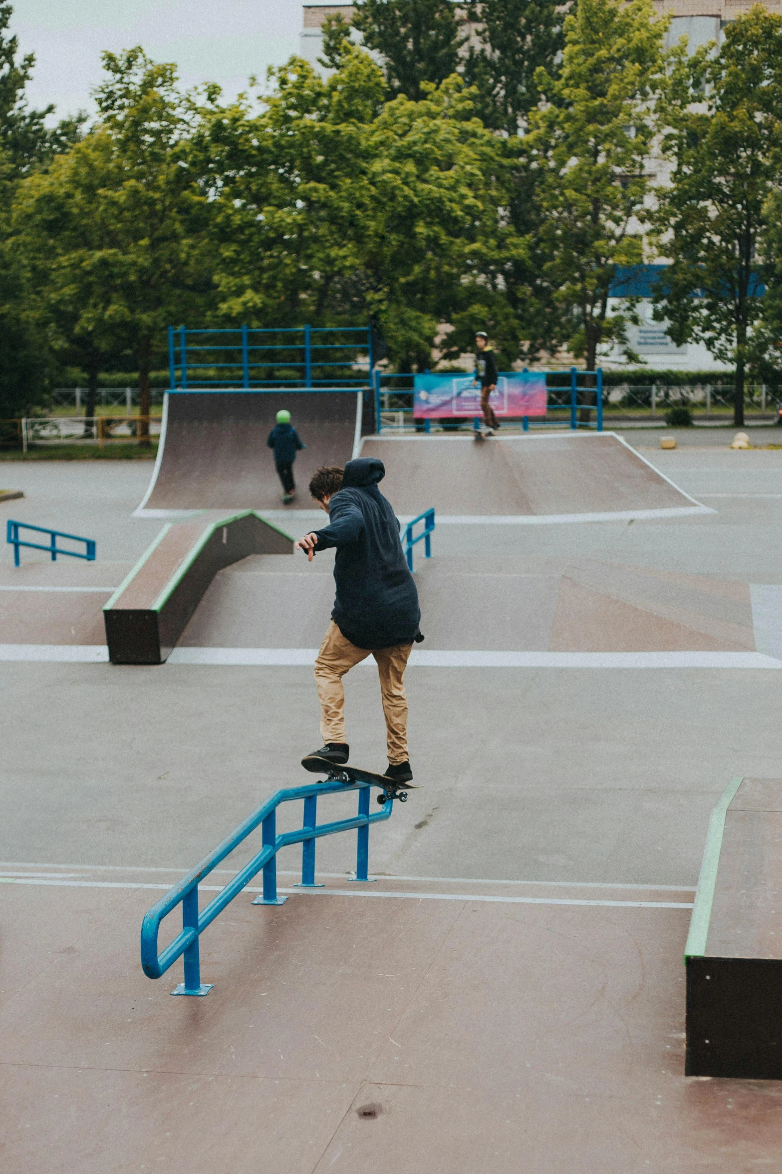 a person on a skateboard doing tricks on a rail