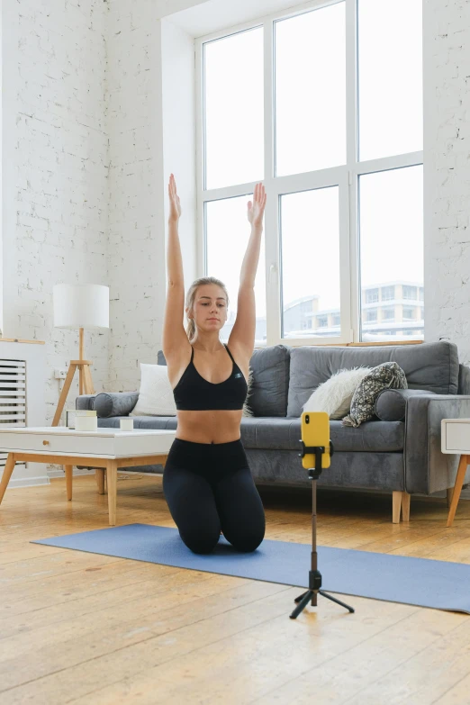 a woman is doing yoga on her stomach