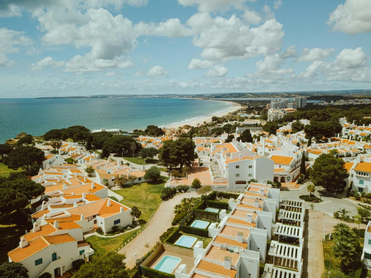 a bird's eye view of a beach town near the ocean