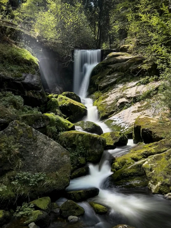 a very pretty waterfall flowing over some rocks