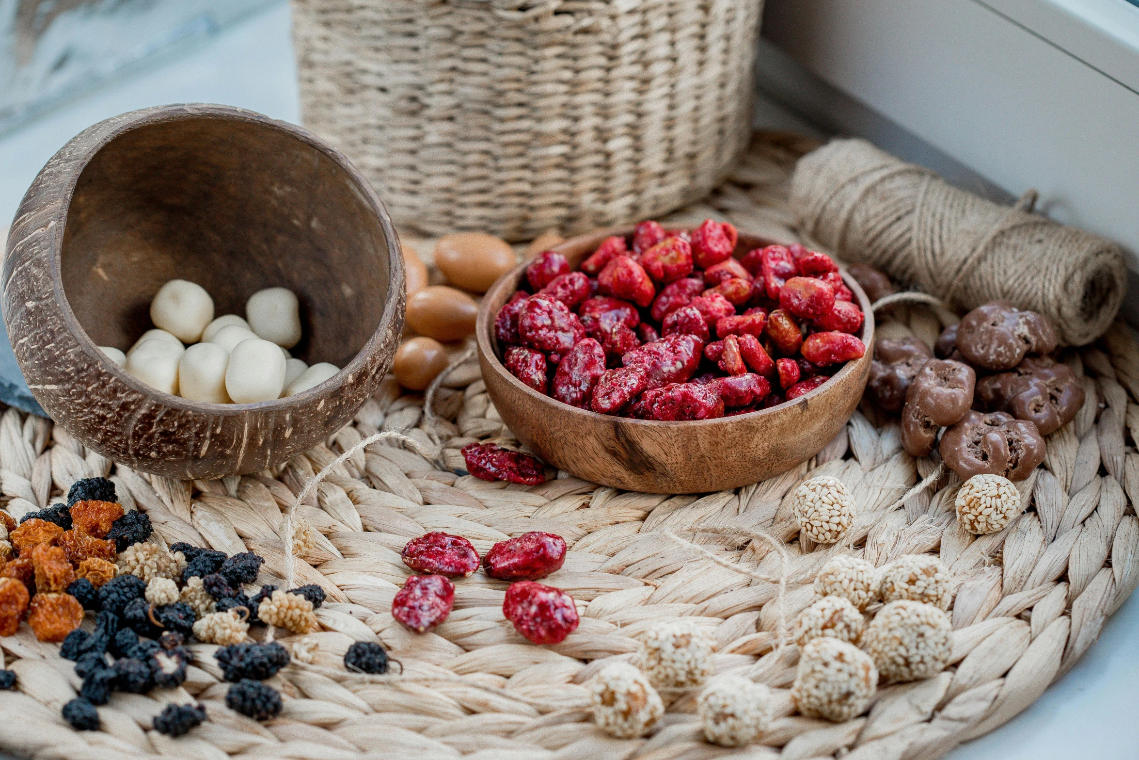 a basket filled with lots of strawberries and nuts