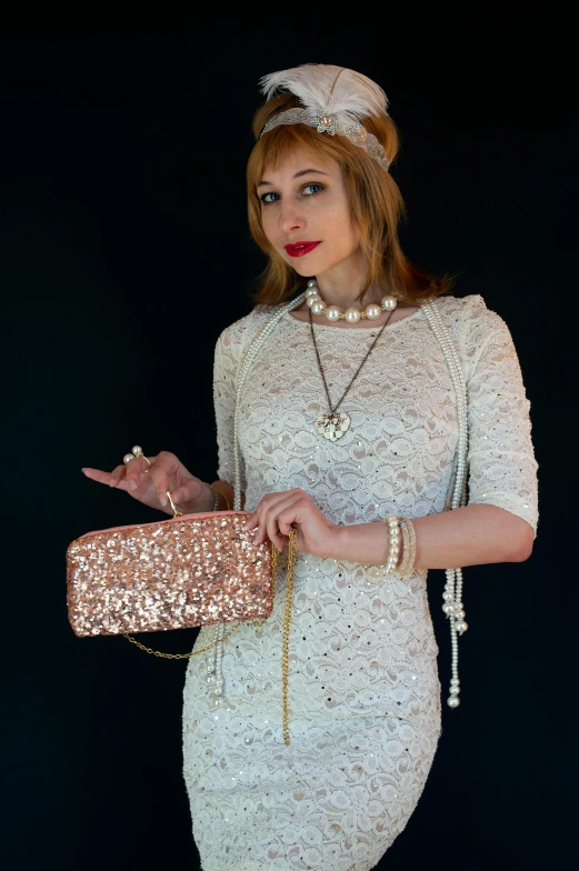 a woman with an evening bag and pearls