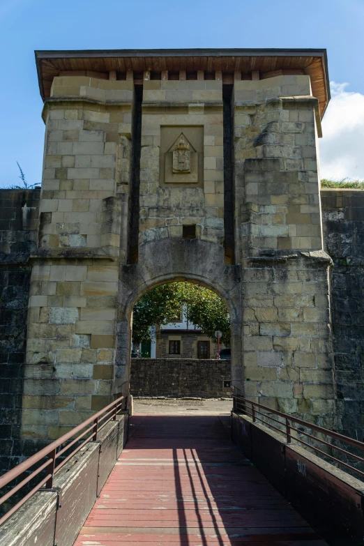 a building with an archway to it with stairs