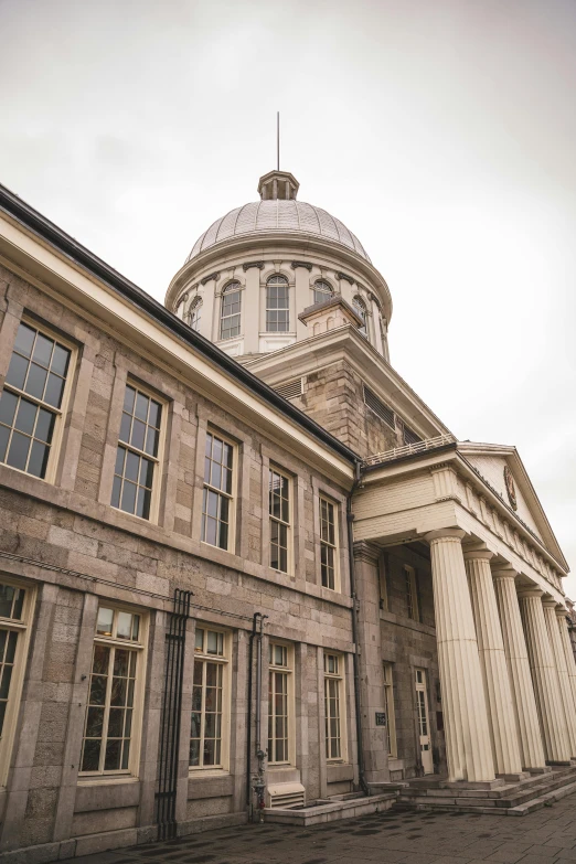 a building has columns and a dome on top