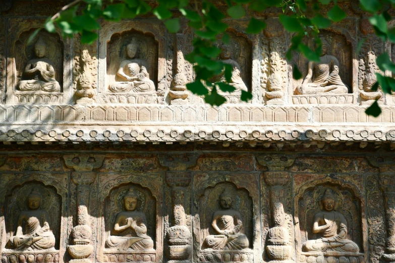 an elaborate carving in the side wall of a temple