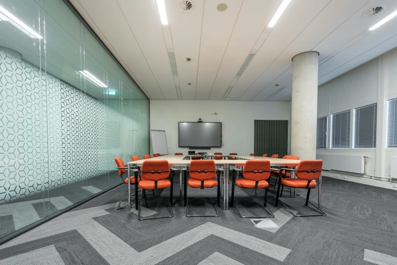 a large conference table and chairs are shown