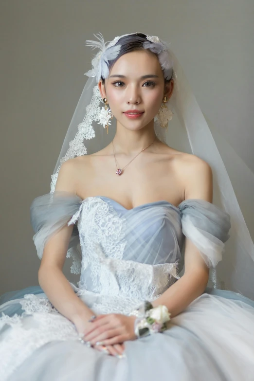 a young woman wearing a tiara and wedding dress
